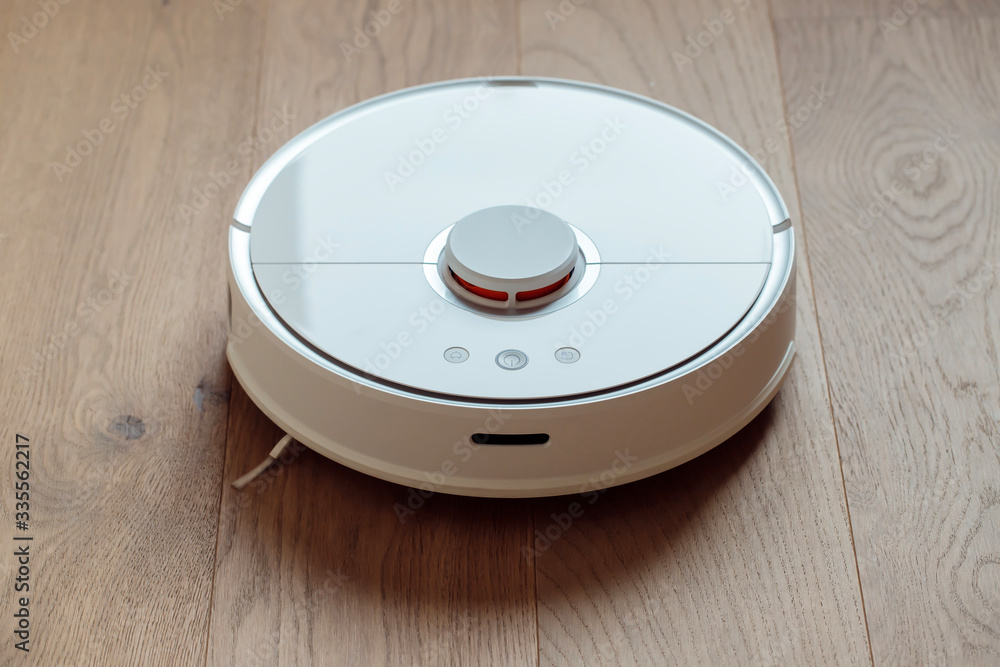 Robot vacuum cleaner performs automatic cleaning of the apartment smart home Robot vacuum cleaner performs automatic cleaning of the apartment smart home