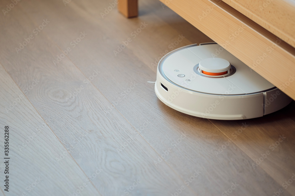 Robot vacuum cleaner performs automatic cleaning of the apartment smart home Robot vacuum cleaner performs automatic cleaning of the apartment smart home
