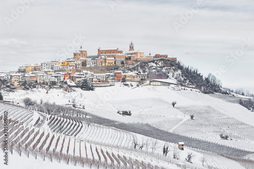 Langhe, Cuneo district, Piedmont, Italy. Langhe wine region winter snow,La Morra village. photo