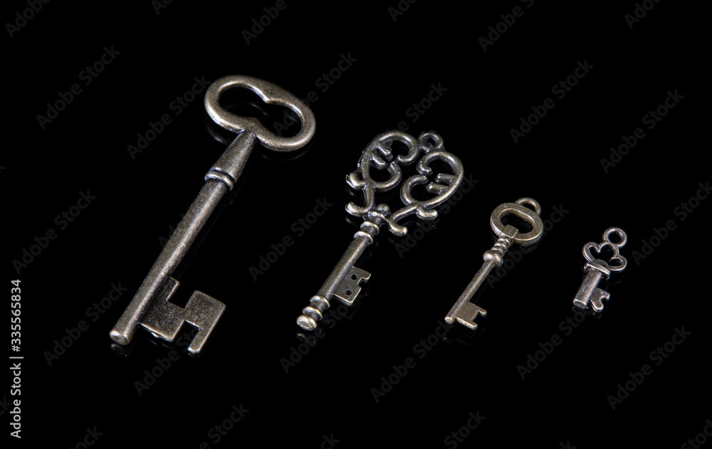 Old keys on a black background Old keys on a black background