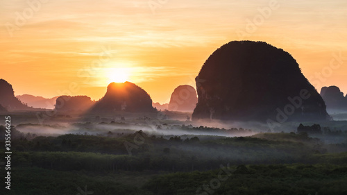 Limestone mountains and mist at sunrise  Krabi