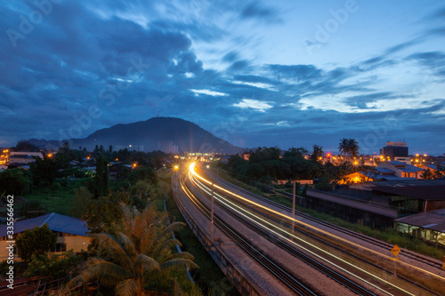 Light trail of KTM train in morning at Bukit Mertajam, Penang.