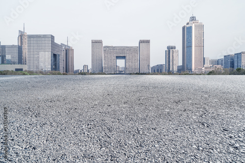 Obraz na płótnie Modern business office buildings with empty road w salonie