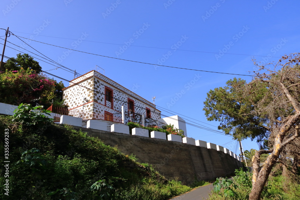 Colorful homes in Vallehermoso town and valley on the island of La Gomera, Canary Islands, Spain Colorful homes in Vallehermoso town and valley on the island of La Gomera, Canary Islands, Spain