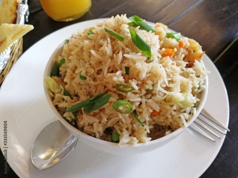 delicious rice with vegetables served in a Cup in an Indian cafe. healthy and delicious food delicious rice with vegetables served in a Cup in an Indian cafe. healthy and delicious food