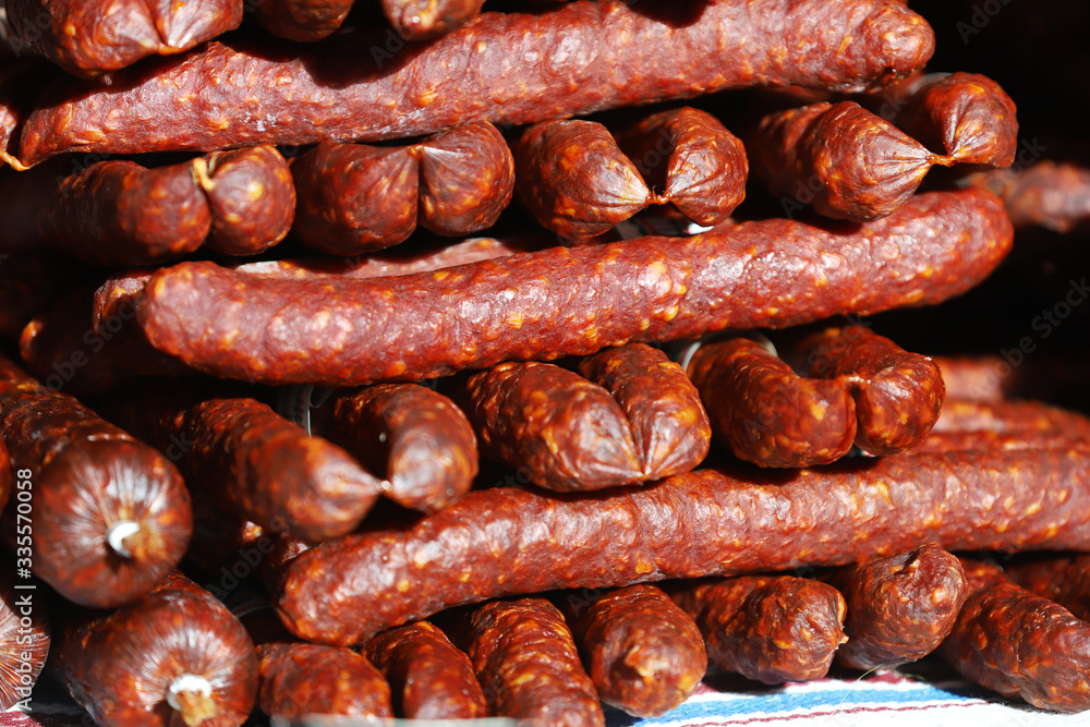 Traditional famous hungarian sausages arranged at the stand Traditional famous hungarian sausages arranged at the stand