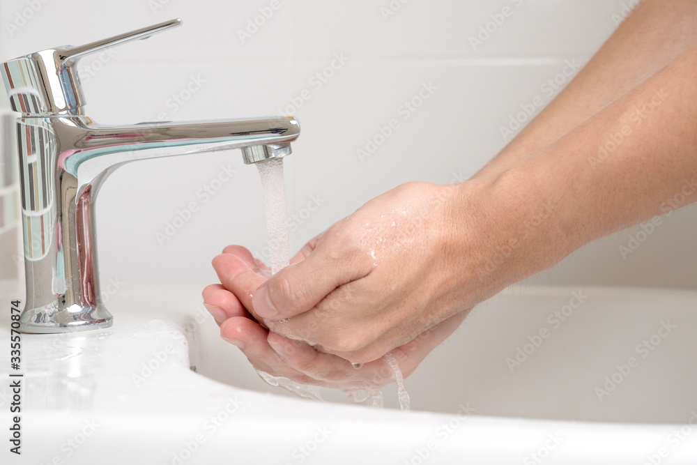 Closeup of hand cleaning by rubbing with soap to prevent corona virus or COVID-19. Hygiene to stop coronavirus and bacteria. Closeup of hand cleaning by rubbing with soap to prevent corona virus or COVID-19. Hygiene to stop coronavirus and bacteria.