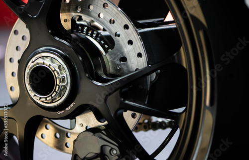 Motorbike disc brake system on a motorcycle, close up.