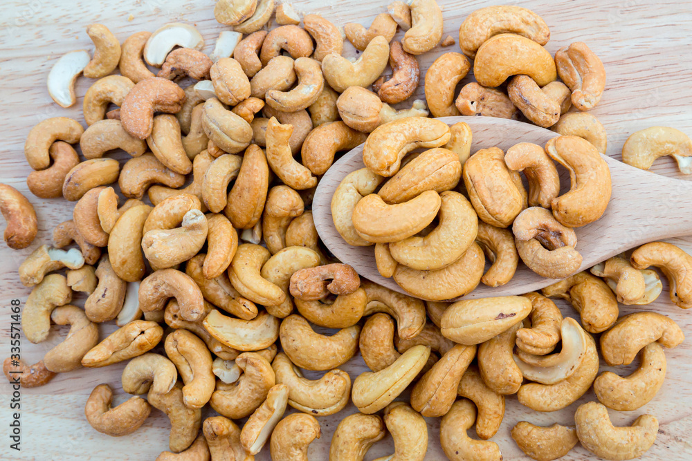 Fototapeta premium Tasty cashew nuts. The cashew tree is a tropical evergreen tree that produces the cashew seed and the cashew apple.