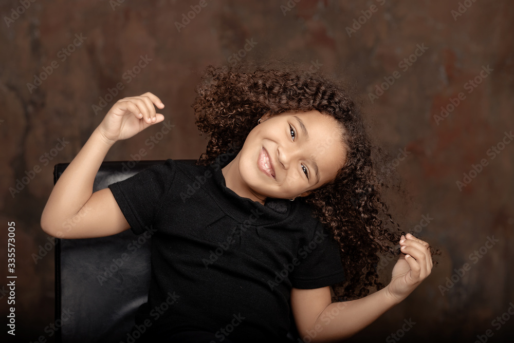 Cute African American girl smiling in the street. Cute African American girl smiling in the street.