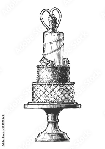 Wedding cake with a cake-topper of a groom and bride