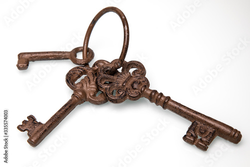 
Old keys on a white background