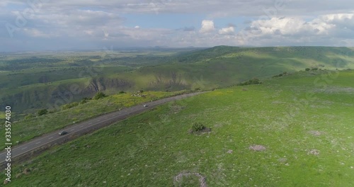 Aerial shot above Golan Heights and Taiberia in North of Israel. Open fields with green landscapes and mountains above Galilee sea or Kinnert at Jordan valley  photo