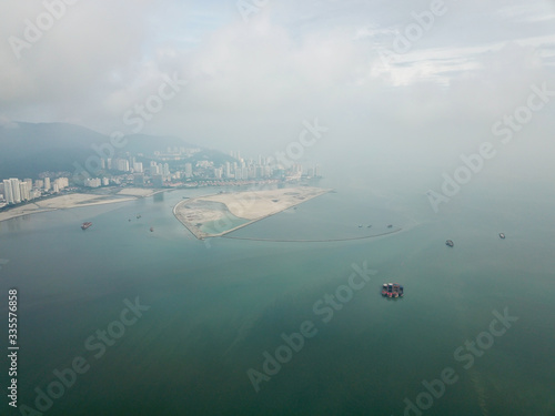 Fototapeta Naklejka Na Ścianę i Meble -  Aerial fog morning at reclamation island Gurney Wharf, Penang.