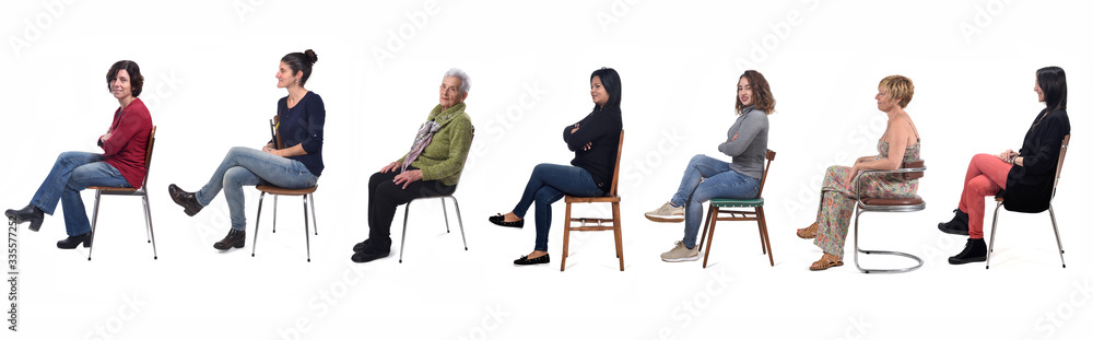 group of women sitting on chair on white background, side view - obrazy, fototapety, plakaty 