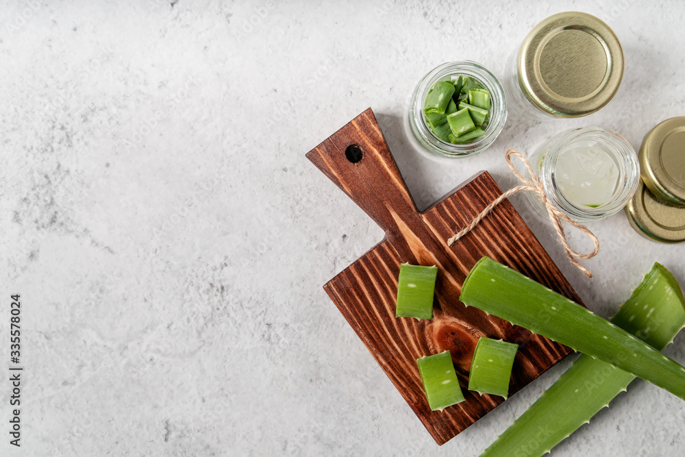 Top view of aloe vera slices on a cutting board with copy space Top view of aloe vera slices on a cutting board with copy space