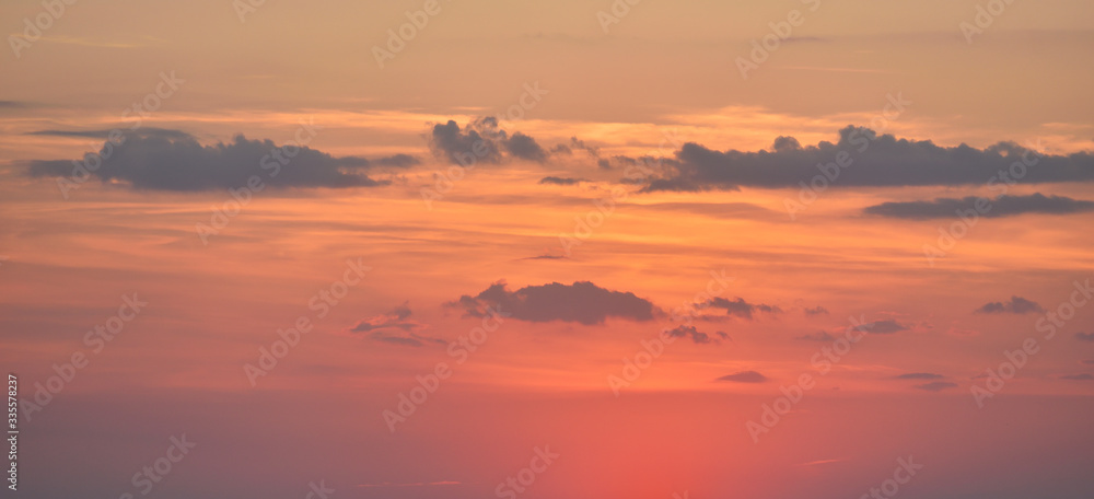 Beautiful view of a red sunset in the sky with clouds.