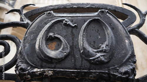 detail of an old rusty metal door knocker