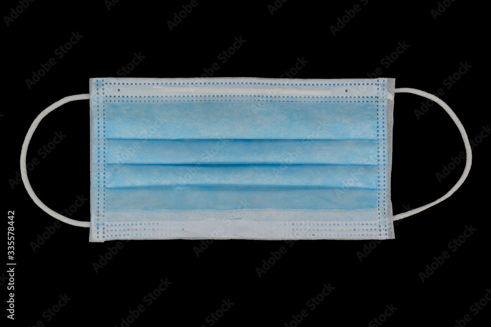 Blue color outer medical mask isolated on black background. Blue color outer medical mask isolated on black background.