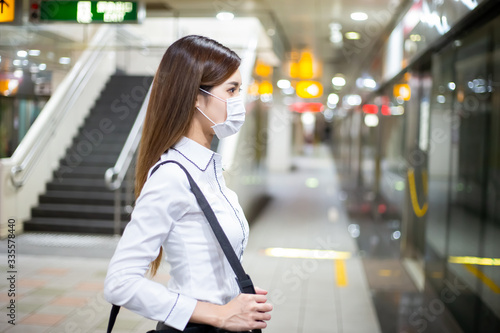 woman with mask in station