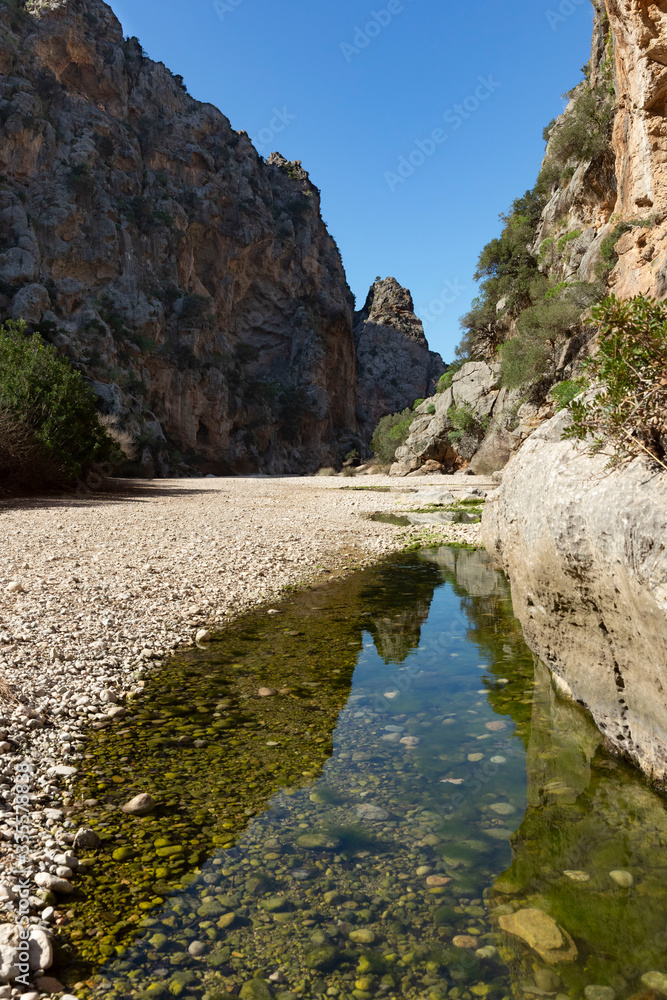 Beautiful landscapes in Sa Calobra, a gravelly rock beach that makes its way between a large mountain. Mallorca, Spain