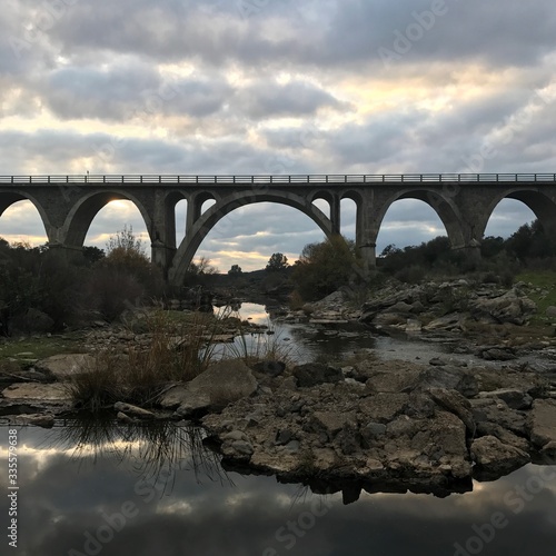 Roman bridge over ardila river with sunset in Oliva de la Frontera, Spain