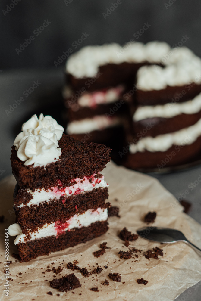 Chocolate cake with cream and raspberries. Cut piece Chocolate cake with cream and raspberries. Cut piece
