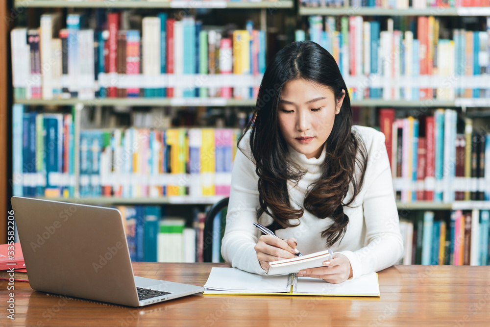 Young beautiful asian student study or work at home and using laptop for online learning.e-Learning education concept.Back to school Young beautiful asian student study or work at home and using laptop for online learning.e-Learning education concept.Back to school