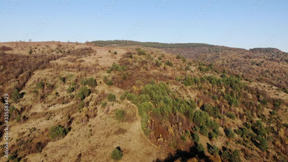 Aerial drone view of mountainous terrain with forests, pan around. Stories about nature Aerial drone view of mountainous terrain with forests, pan around. Stories about nature