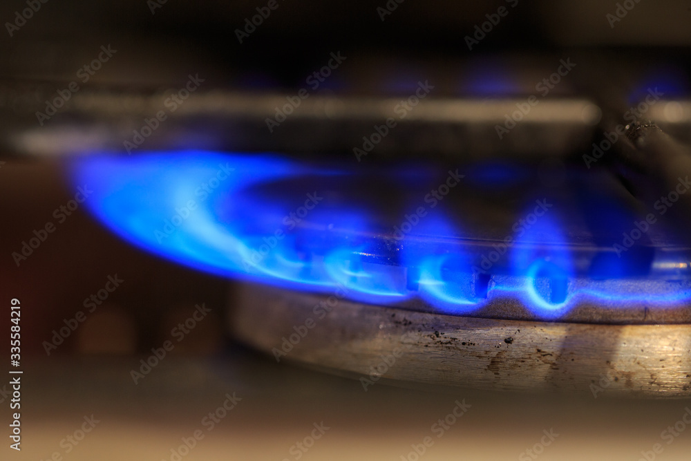 Old gas burner, blue gas flameOld gas burner, blue gas flame Old gas burner, blue gas flameOld gas burner, blue gas flame