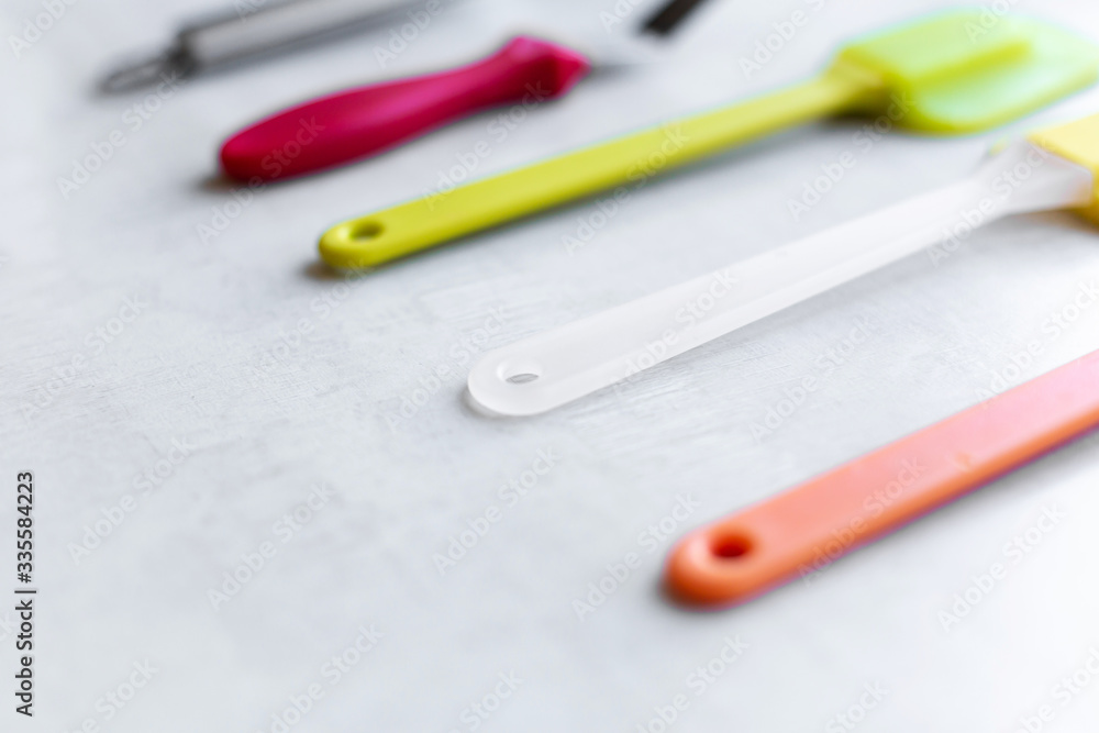 Set of multi-colored silicone spatulas, kitchen tools. Sweet pastries, recipes, cooking Set of multi-colored silicone spatulas, kitchen tools. Sweet pastries, recipes, cooking