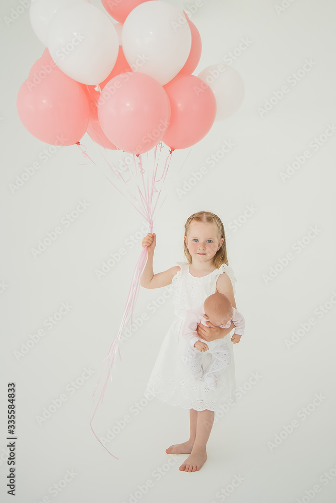 little girl in a white dress with balloons little girl in a white dress with balloons