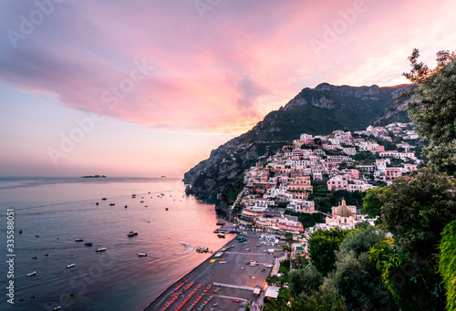 Positano, Amalfi Coast, Campania, Sorrento, Italy. View of the town and the seaside in a summer sunset
