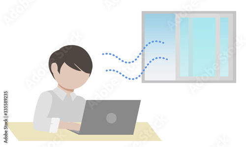オフィスの換気をしながら仕事をする男性会社員