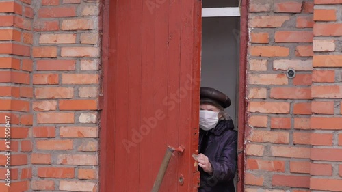 Wallpaper Mural Coronavirus pandemic, senior woman in self quarantine to avoid spread of infection by virus covid-19. Stay home looking outdoor from the window. Prevention concept Torontodigital.ca