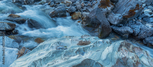 Rock formation and texture carved out of crystal clear water for years in mountain creek - wild nature Concept. 