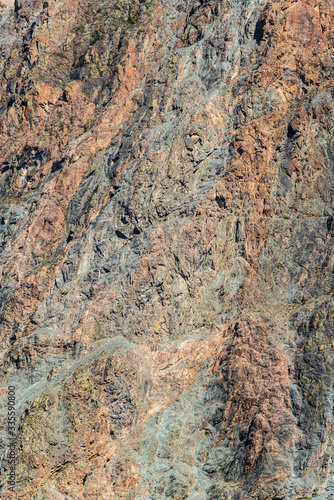The texture of the rocky slope of a mountain gorge. Russia, Altai Republic, Ulagansky District, Chulyshman Valley