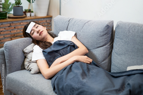 Fotografie Asian young woman sick with coronavirus