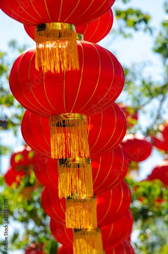 Row of red lantern with green background.