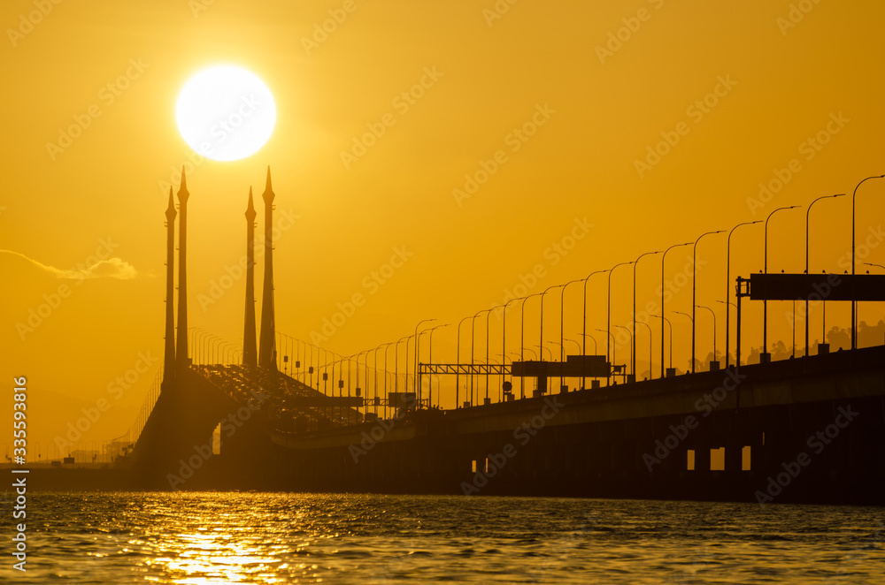 Obraz premium Gold sun rise over architecture cable stayed Penang Bridge.