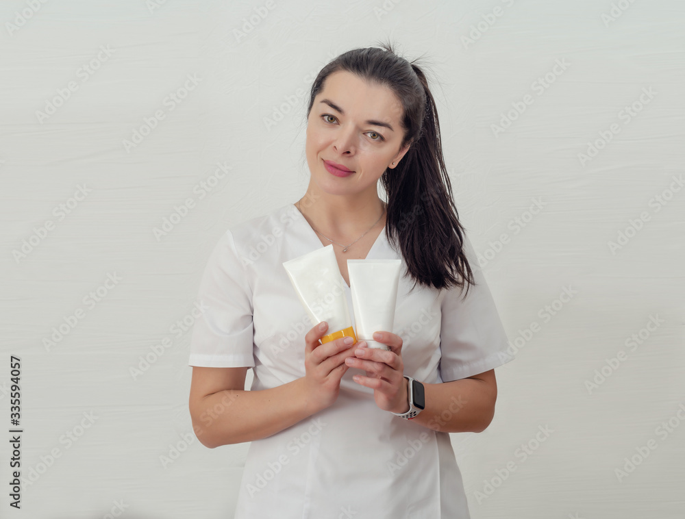 Female doctor shows medicine packaging. Female doctor shows medicine packaging.