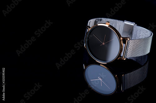 Wrist watch for women on black background