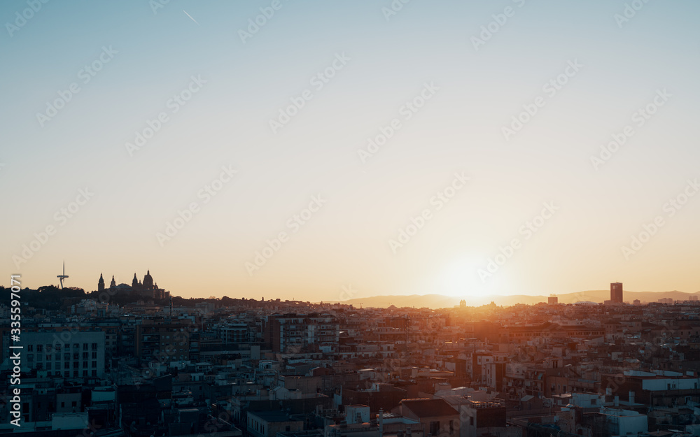 Scenic view of city at sunset against clear sky