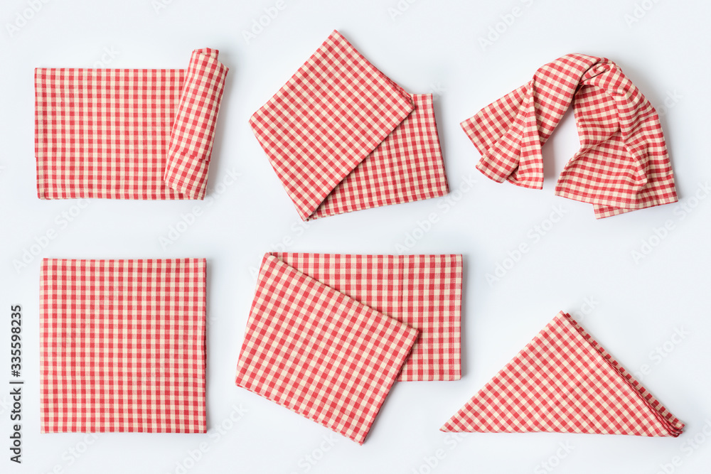 Red tablecloth or kitchen towel collection on white background. Cooking or baking mock up for design. Top view from above Red tablecloth or kitchen towel collection on white background. Cooking or baking mock up for design. Top view from above