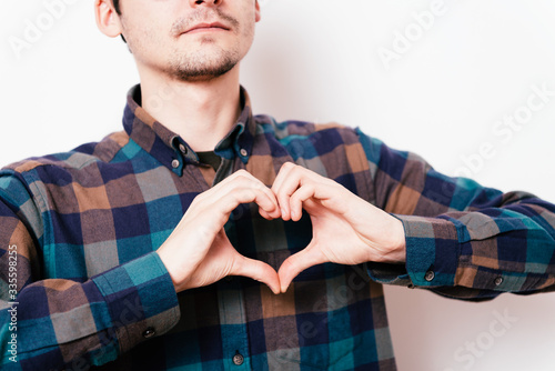 man making a hand heart frame