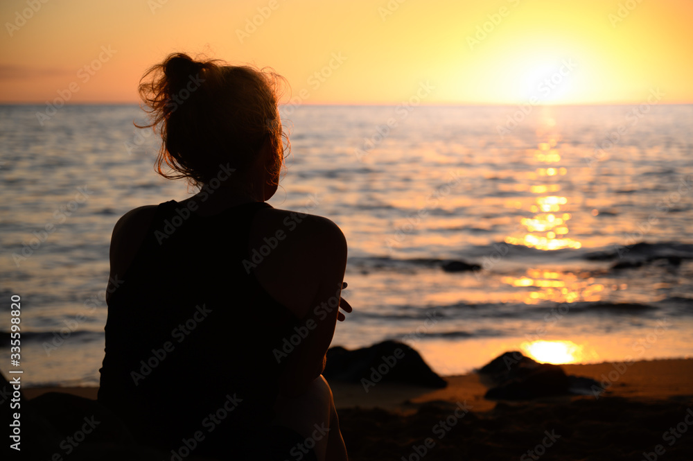 Woman Beautiful sunset on Spencer beach - Big Island, Hawaii