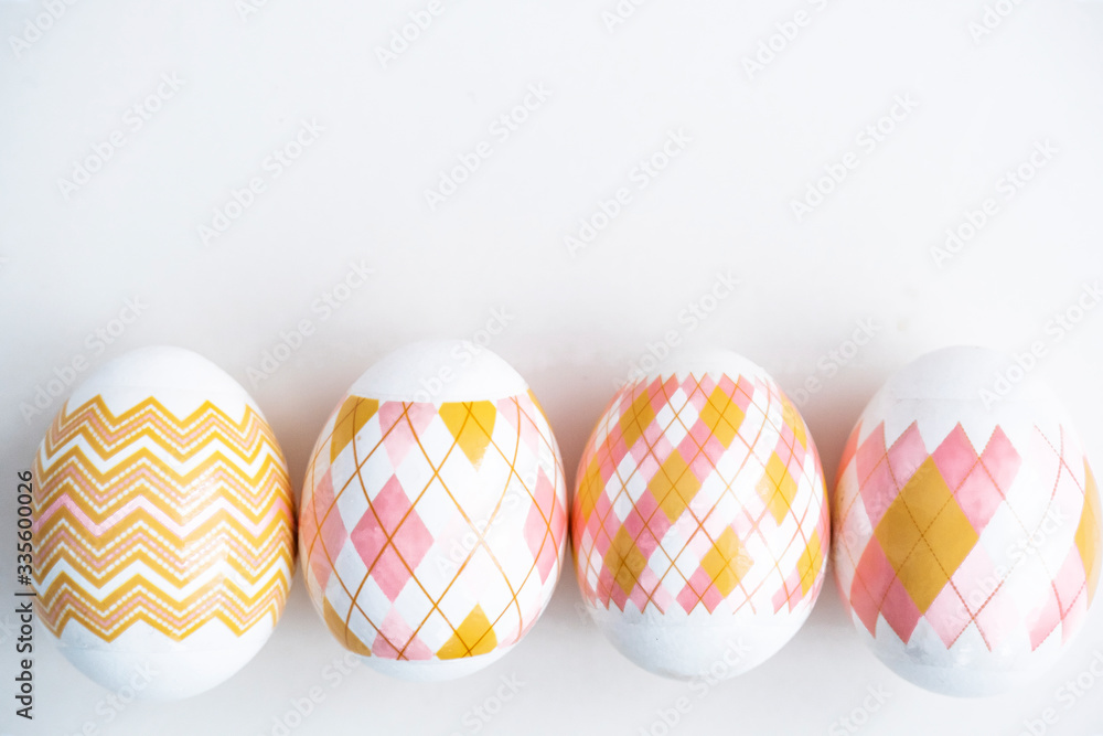 Russian traditional easter. Four painted eggs on a white background. Religious holiday Easter.