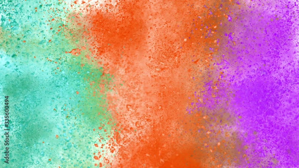 Colorful powder exploding on white background in super slow motion, close-up. Colorful powder exploding on white background in super slow motion, close-up.