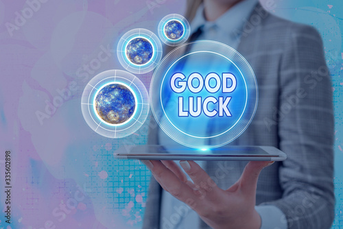 Conceptual hand writing showing Good Luck. Concept meaning wish a positive fortune or a happy outcome that a demonstrating can have Elements of this image furnished by NASA photo