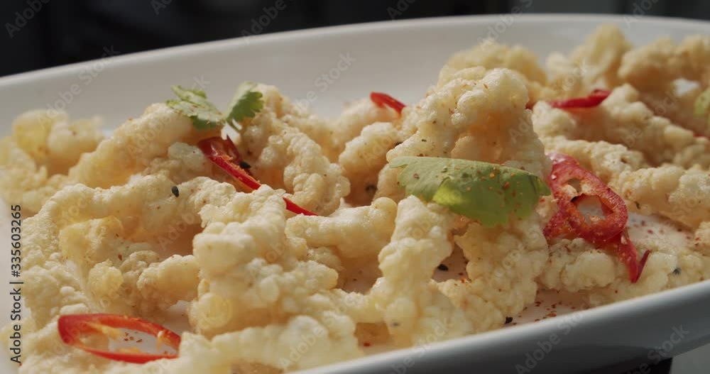 Dish of eggplant with red pepper. Dish of eggplant with red pepper.